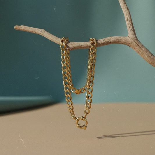 Aramat Jewels gold-tone stainless steel curb chain necklace, 7mm wide, with a secure clasp.