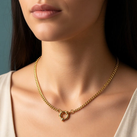 Aramat Jewels gold-tone stainless steel gourmet link necklace, 3mm wide, with a circular clasp. Worn by a model.