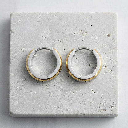 Aramat Jewels bicolor stainless steel hoop earrings with gold accents, 16mm diameter.