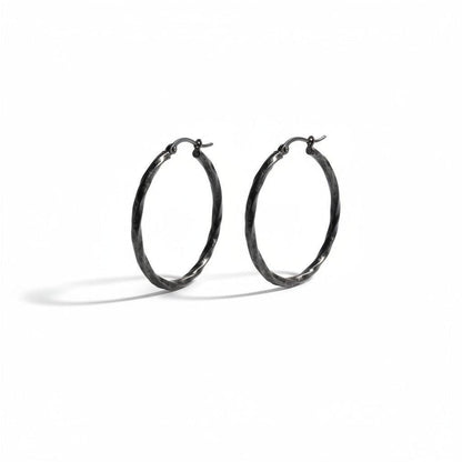 Aramat Jewels black twisted stainless steel hoop earrings, 40mm diameter, high gloss finish, statement jewelry for women.
