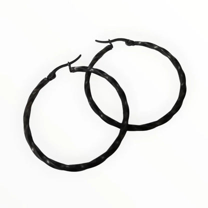 Aramat Jewels black twisted stainless steel hoop earrings, 40mm diameter, high gloss finish.