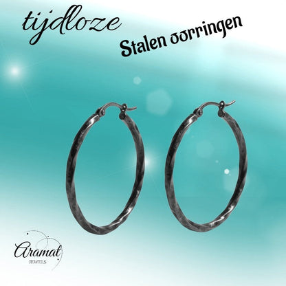 Aramat Jewels black twisted stainless steel hoop earrings, 40mm diameter, high gloss finish, statement jewelry for women.