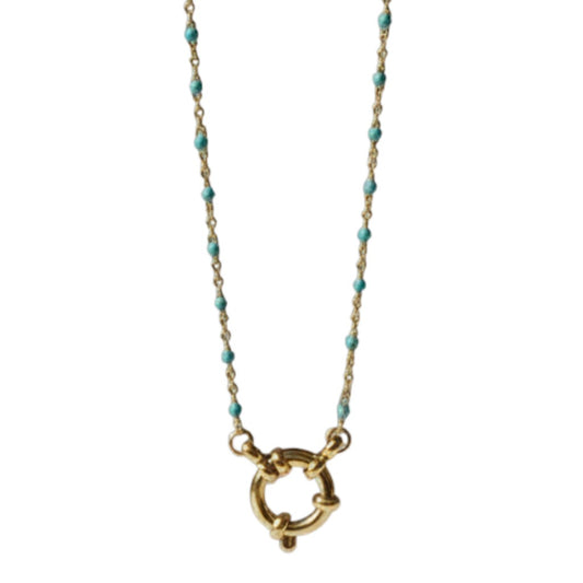 Aramat Jewels gold chain necklace with small blue enamel beads and a circular clasp, displayed on a branch.