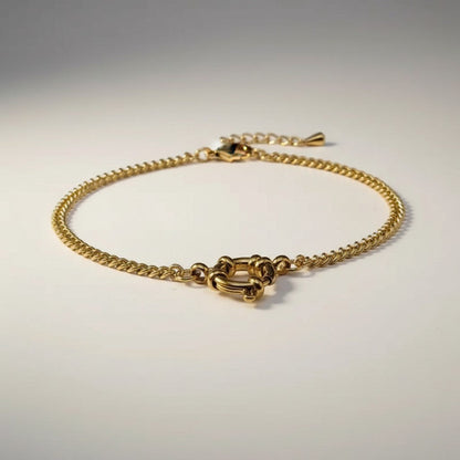 Aramat Jewels gold-colored stainless steel gourmet link chain necklace, 3mm wide, with a circular clasp.