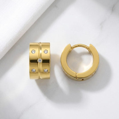 Aramat Jewels gold-tone stainless steel hoop earrings with 5 clear cubic zirconia stones.