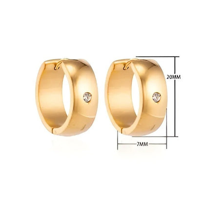 Aramat Jewels gold-tone stainless steel huggie hoop earrings with a central cubic zirconia stone. Dimensions shown are 20mm diameter and 7mm width.