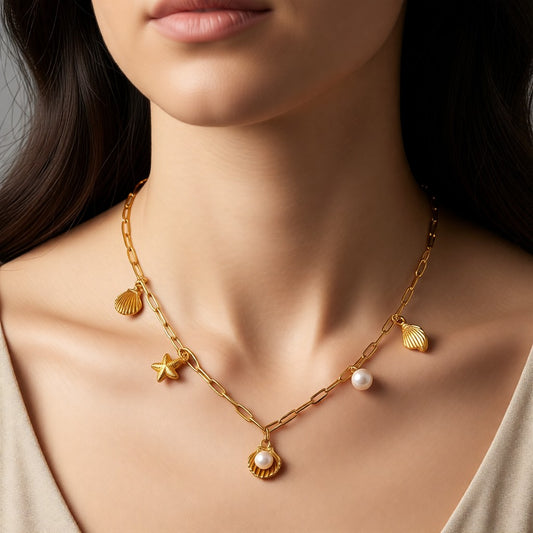 Aramat Jewels gold-tone stainless steel necklace with shell, pearl, and starfish charms, 45cm length.