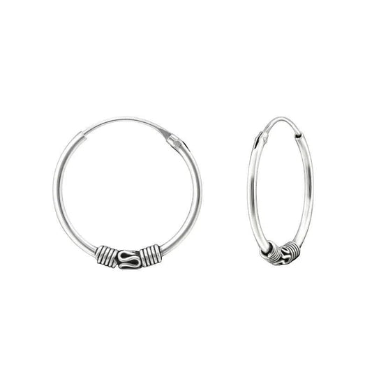 Aramat Jewels 18mm oxidized silver Bali hoop earrings with intricate tribal detailing.