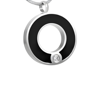 Aramat Jewels ronde zwarte stalen ashanger met een schroefsluiting en een klein steentje.