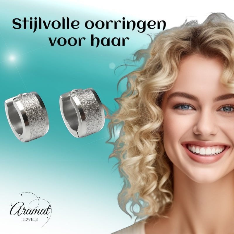Aramat Jewels sandblasted silver-tone stainless steel huggie hoop earrings, 13mm, with a textured finish and wide stripe detail.