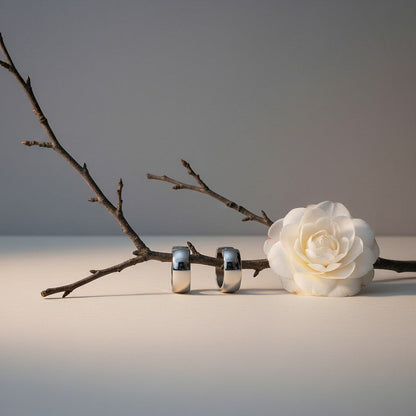 Aramat Jewels silver-coloured stainless steel hoop earrings, 13mm diameter, simple and timeless design, unisex.