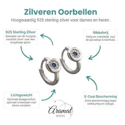 Aramat Jewels silver hoop earrings with blue and clear cubic zirconia, 12mm diameter.