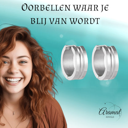 Aramat Jewels silver-colored stainless steel hoop earrings with dynamic stripe design, 19mm diameter, 7mm width, and a polished finish.