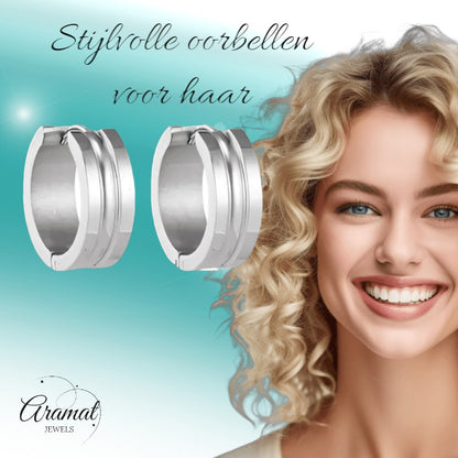 Aramat Jewels silver-colored stainless steel hoop earrings with a dynamic stripe design, 19mm diameter, 7mm width.