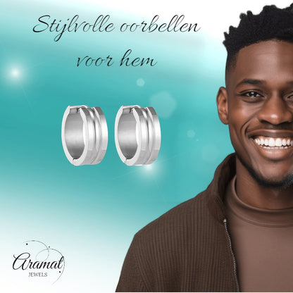 Aramat Jewels silver-colored stainless steel hoop earrings with dynamic stripe design, 19mm diameter, 7mm width.