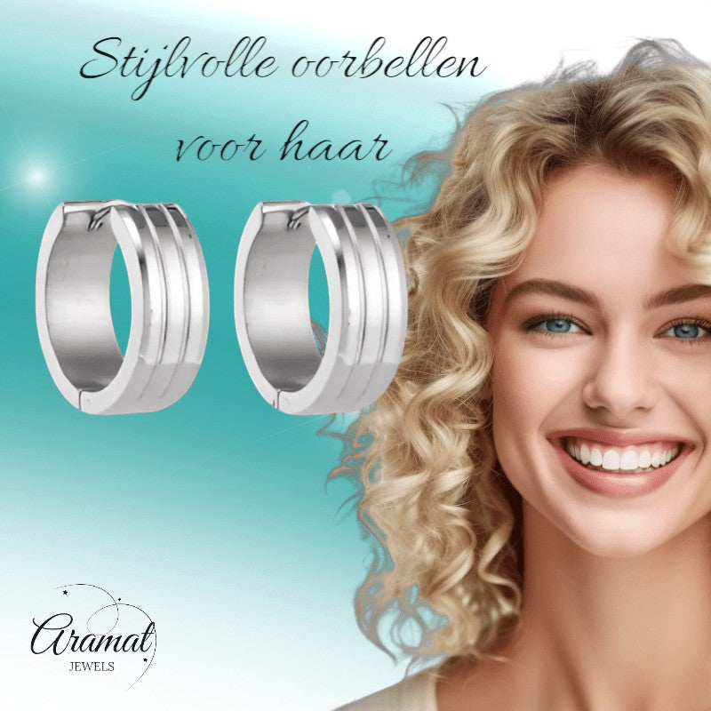 Aramat Jewels silver-tone stainless steel hoop earrings with three raised stripes, 20mm diameter.