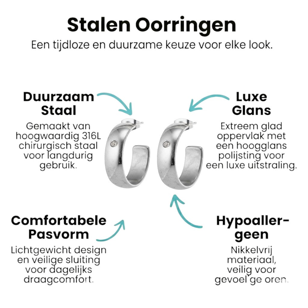 Aramat Jewels silver-tone stainless steel hoop earrings, 23mm diameter, 7mm wide, with a single clear zirconia accent.