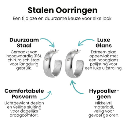 Aramat Jewels silver-tone stainless steel hoop earrings, 23mm diameter, 7mm wide, with a single clear zirconia accent.