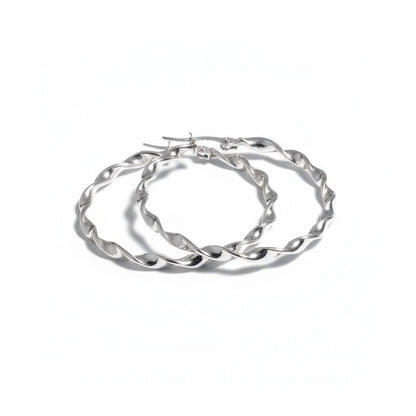 Aramat Jewels silver-tone twisted hoop earrings, 40mm diameter, high-gloss finish, made of stainless steel.