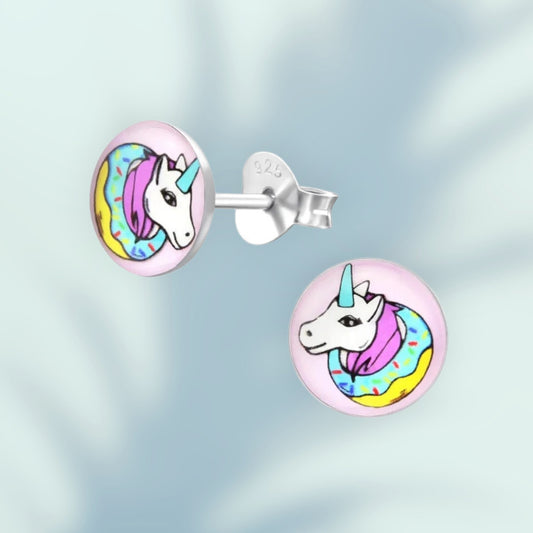 Aramat Jewels 7mm silver stud earrings with a colorful unicorn design on a pink background, featuring a unicorn head with a rainbow mane and a donut-like collar.