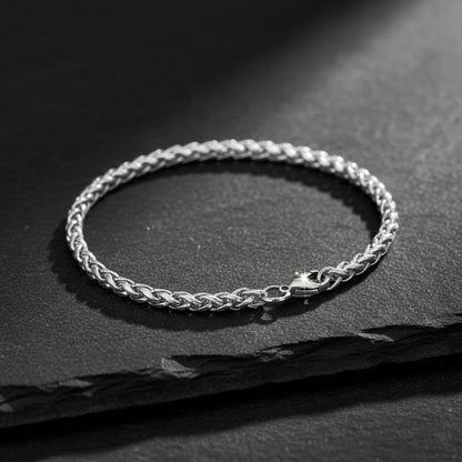 Zilverkleurige Aramat Jewels vossenstaart armband van roestvrij staal met gevlochten schakels, 4 mm breed en 21 cm lang.