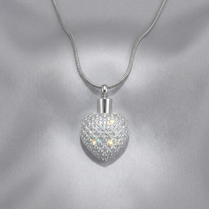 Aramat Jewels zilverkleurige stalen hart ashanger met zirkonia steentjes, waterbestendig en geschikt voor dagelijks gebruik.