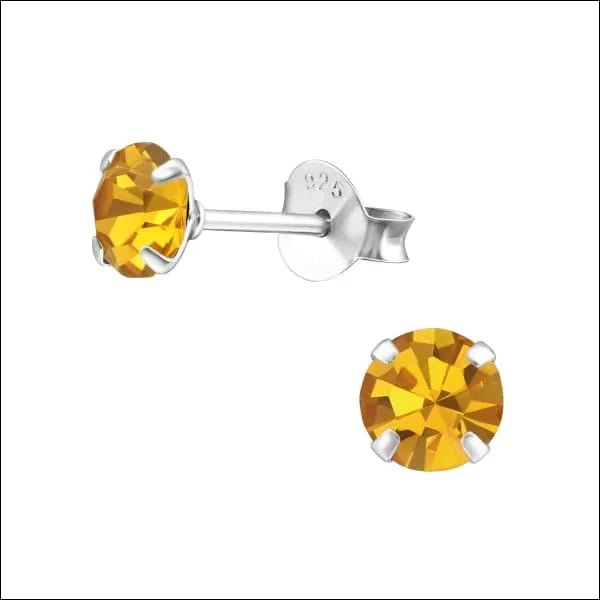 Sterling zilveren oorbellen met geel kristal