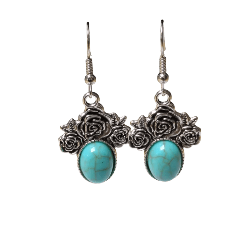 Paar zilveren oorbellen met turquoise stenen en roosmotieven.