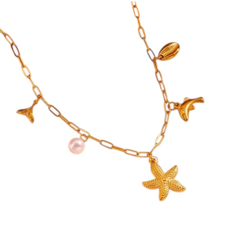 Goudkleurige damesketting met zee - bedels en parel – 45 cm - ket1170 - 511142 - Halskettingen kopen# - 45cm - alles - Bedelketting