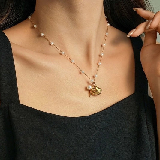 Goudkleurige parelketting met schelp & zeester – 40+5 cm - ket1182 - 599155 - Halskettingen kopen# - 40cm - alles - Bedelketting