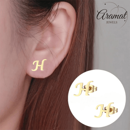 Goudkleurige RVS oorstekers Letter H - Aramat Jewels - Oorbellen - cadeautip