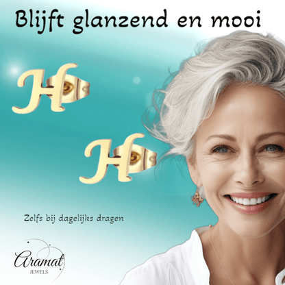 Goudkleurige RVS oorstekers Letter H - Aramat Jewels - Oorbellen - cadeautip