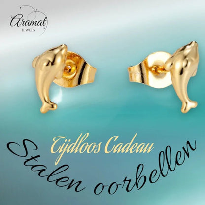 Gouden oorbellen met dolfijn.