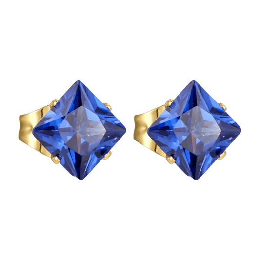 Paar oorbellen met blauwe edelsteen en gouden zetting.