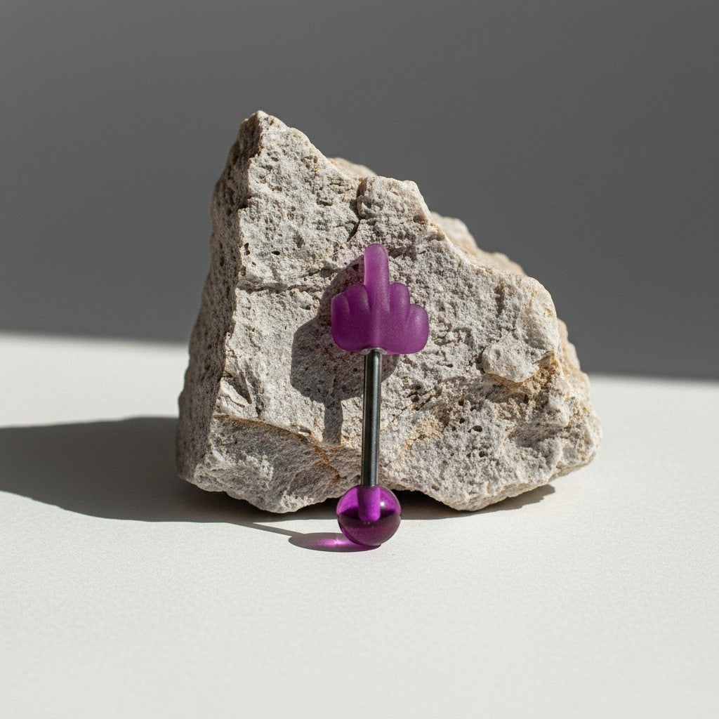 Aramat Jewels purple middle finger tongue piercing with a silver barbell and a purple acrylic ball.