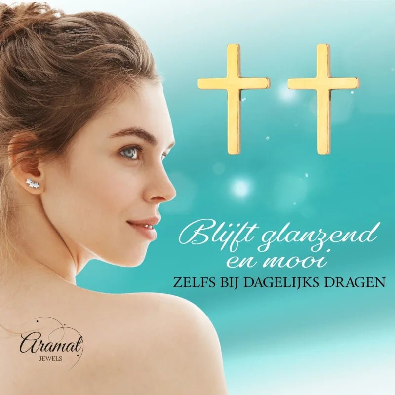 Gouden oorbellen met kruis.