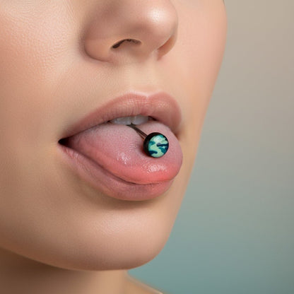 Aramat Jewels camouflage print tongue piercing with black acrylic balls and a steel bar. Features a blue and green camouflage design.