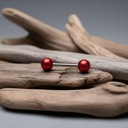 Aramat Jewels red pearl tongue piercing made of surgical steel with a metallic finish.