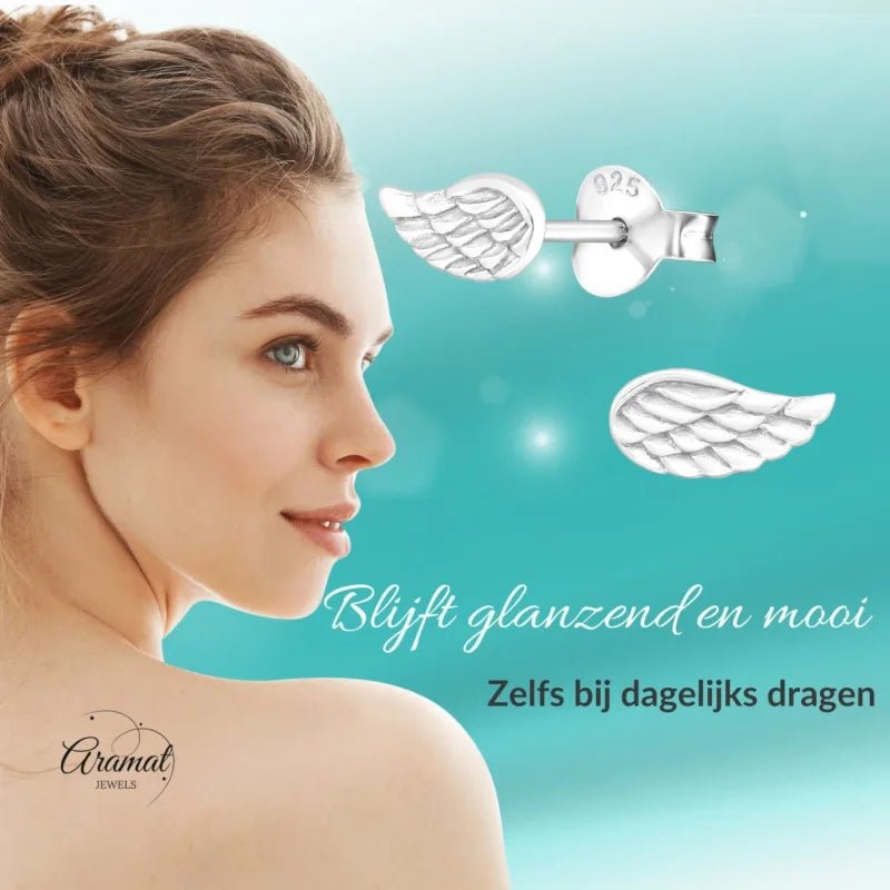 Zilveren oorbellen met engelenvleugels.